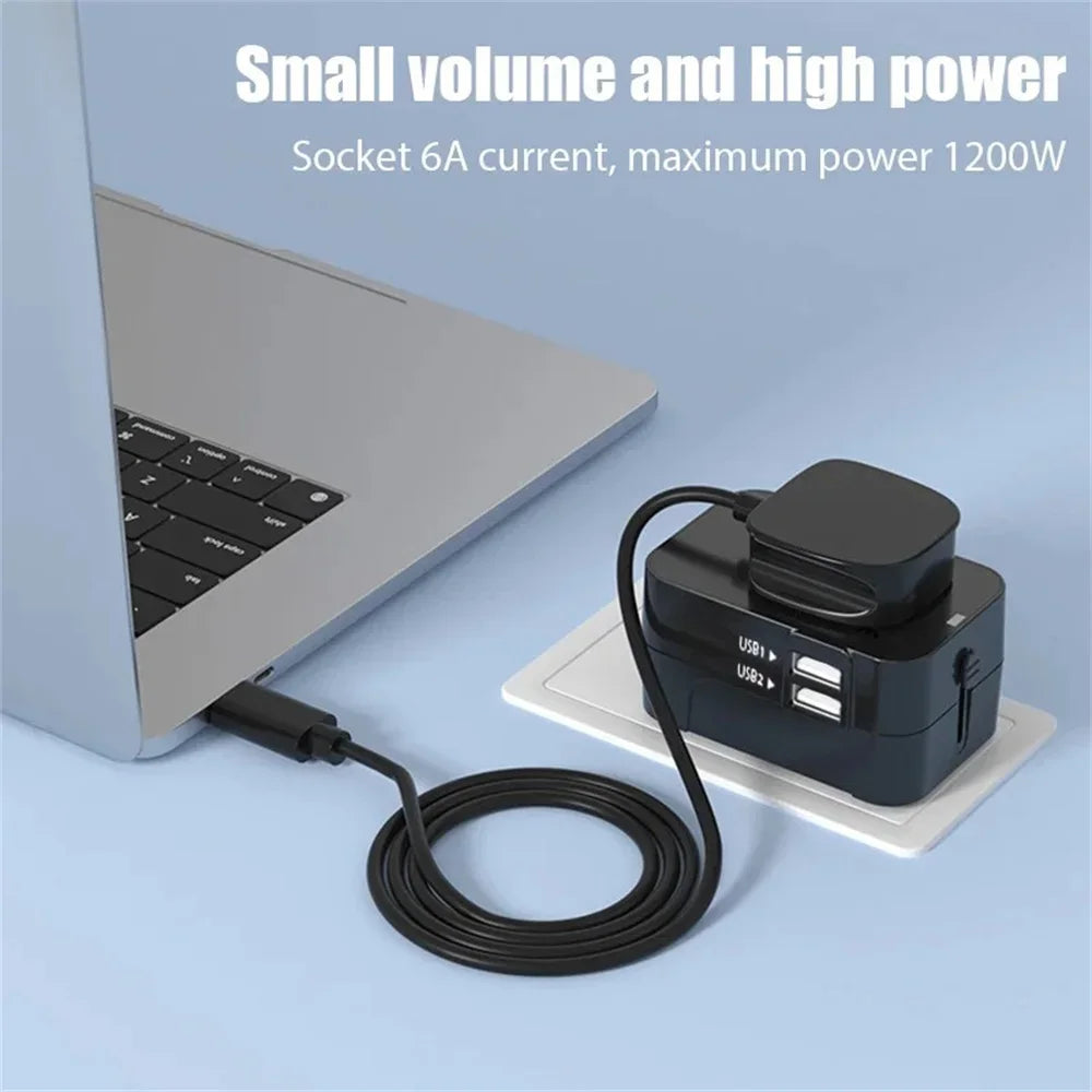 Laptop powered by Universal Travel Adapter.