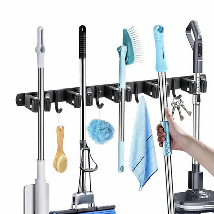 Image of the Mop and Broom Holder holding various items.